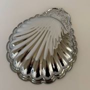 Large silver-plated serving dish in the shape of a vintage shell.