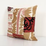 Vintage neutral suzani patchwork pillow fashioned from a mid-20th century samarkand suzani