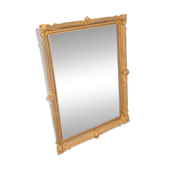 Large French mirror in a gold frame.