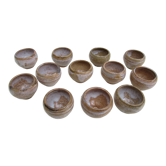 12 individual dishes with beige stoneware snails