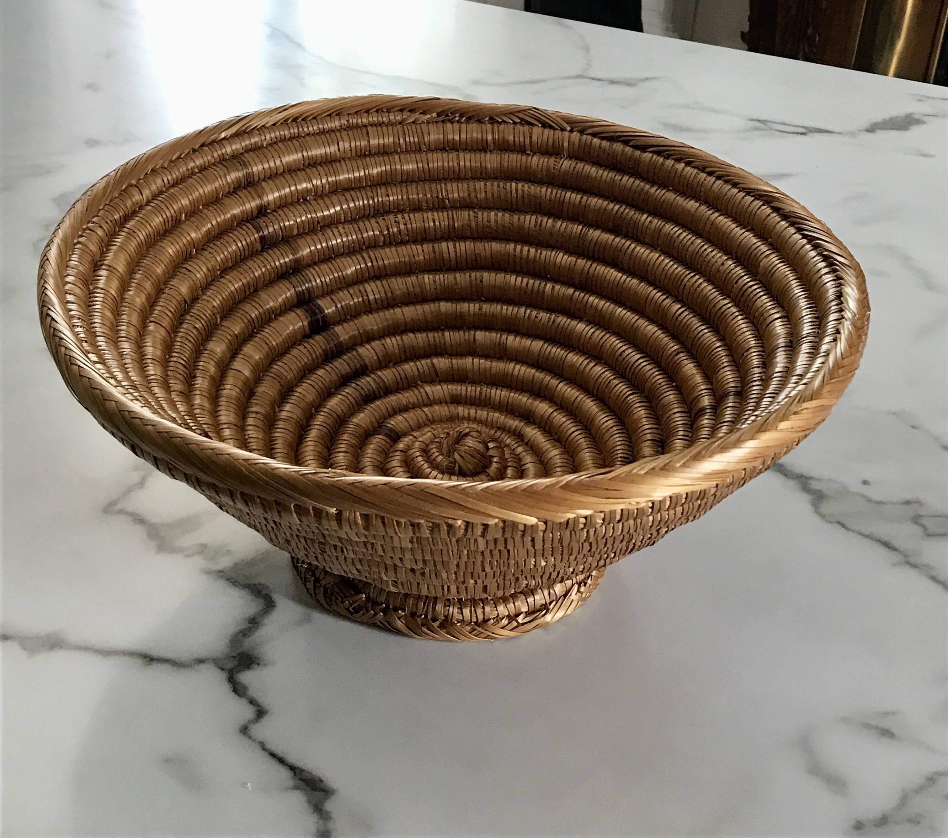 Large bowl on a woven wicker stand