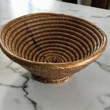 Large bowl on a woven wicker stand