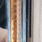 Antique mirror/black and gold frame