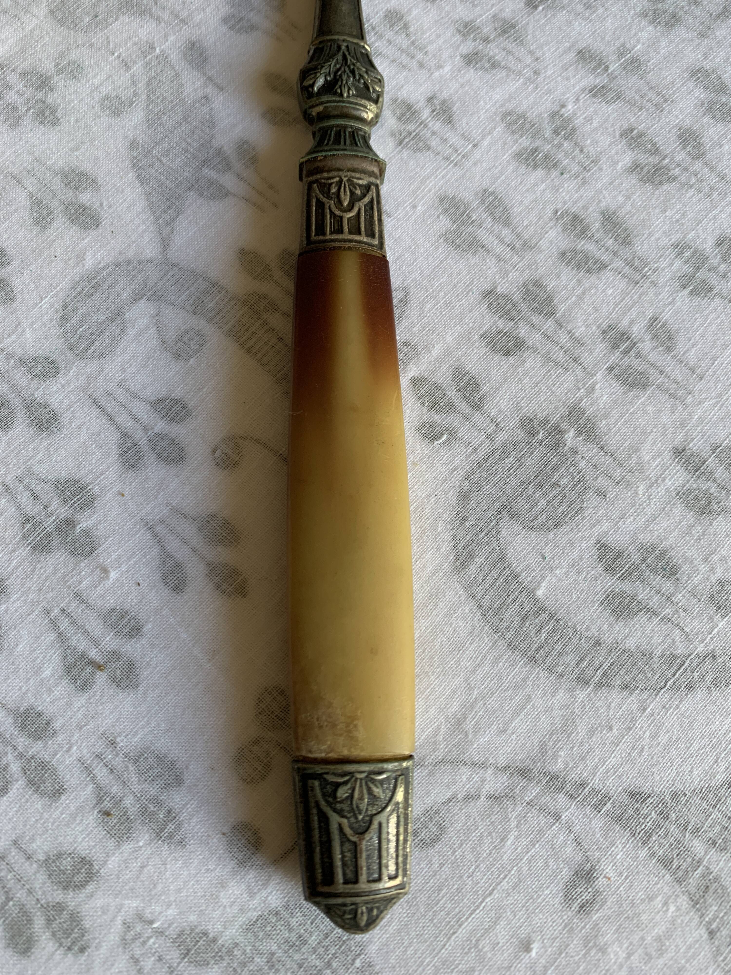 Horn and metal salad servers from the 1920s