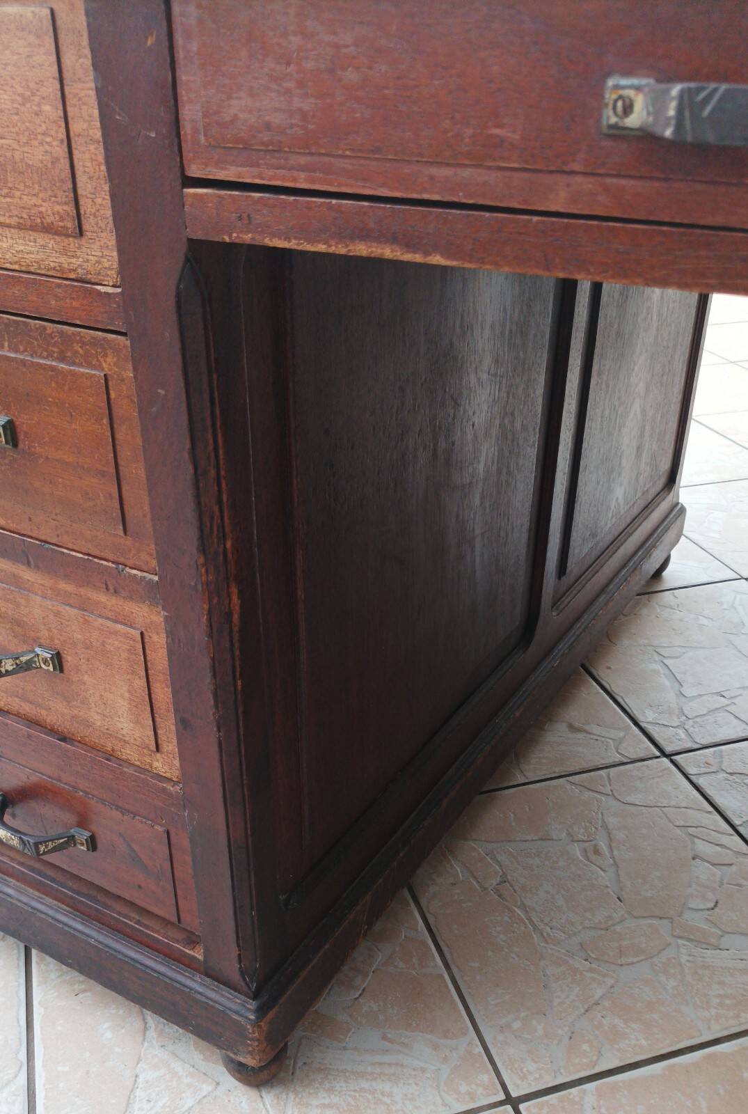 Vintage double-sided mahogany desk with 18 drawers.