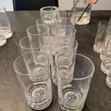 Set of 43 signed Daum crater glasses, an ice bucket, an ashtray,