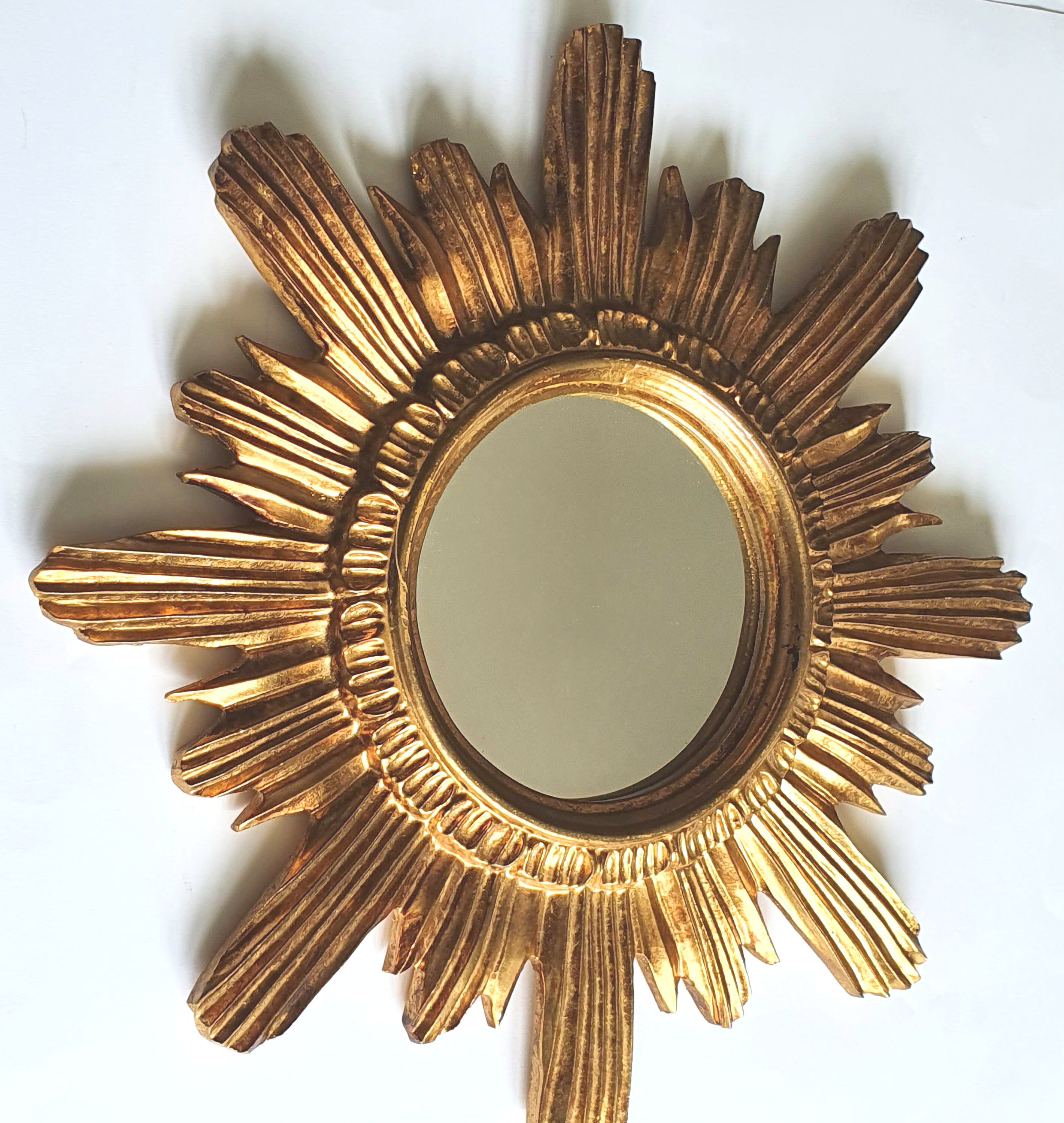 Sun mirror in gilded wood