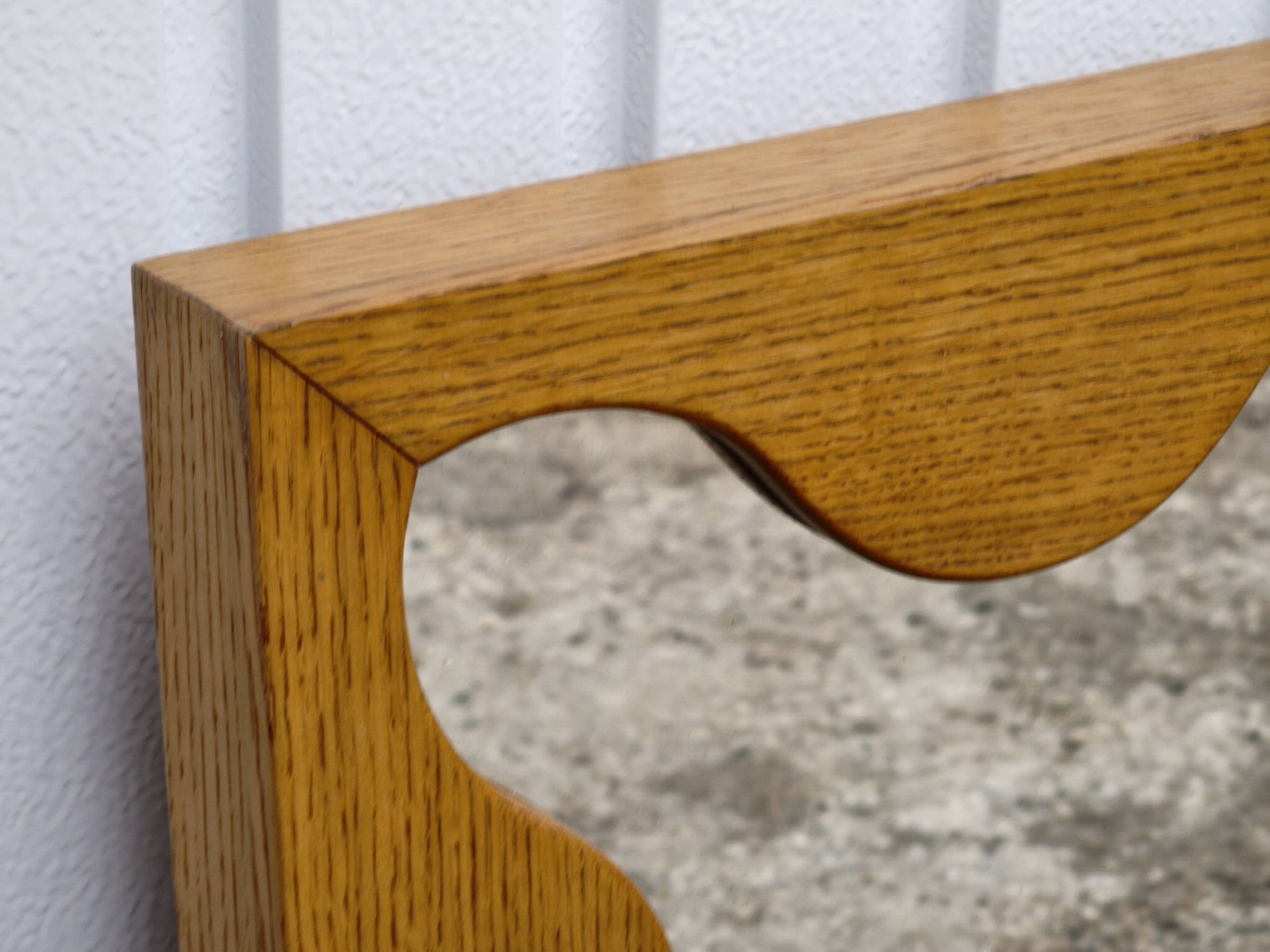 Large antique mirror with an oak frame.