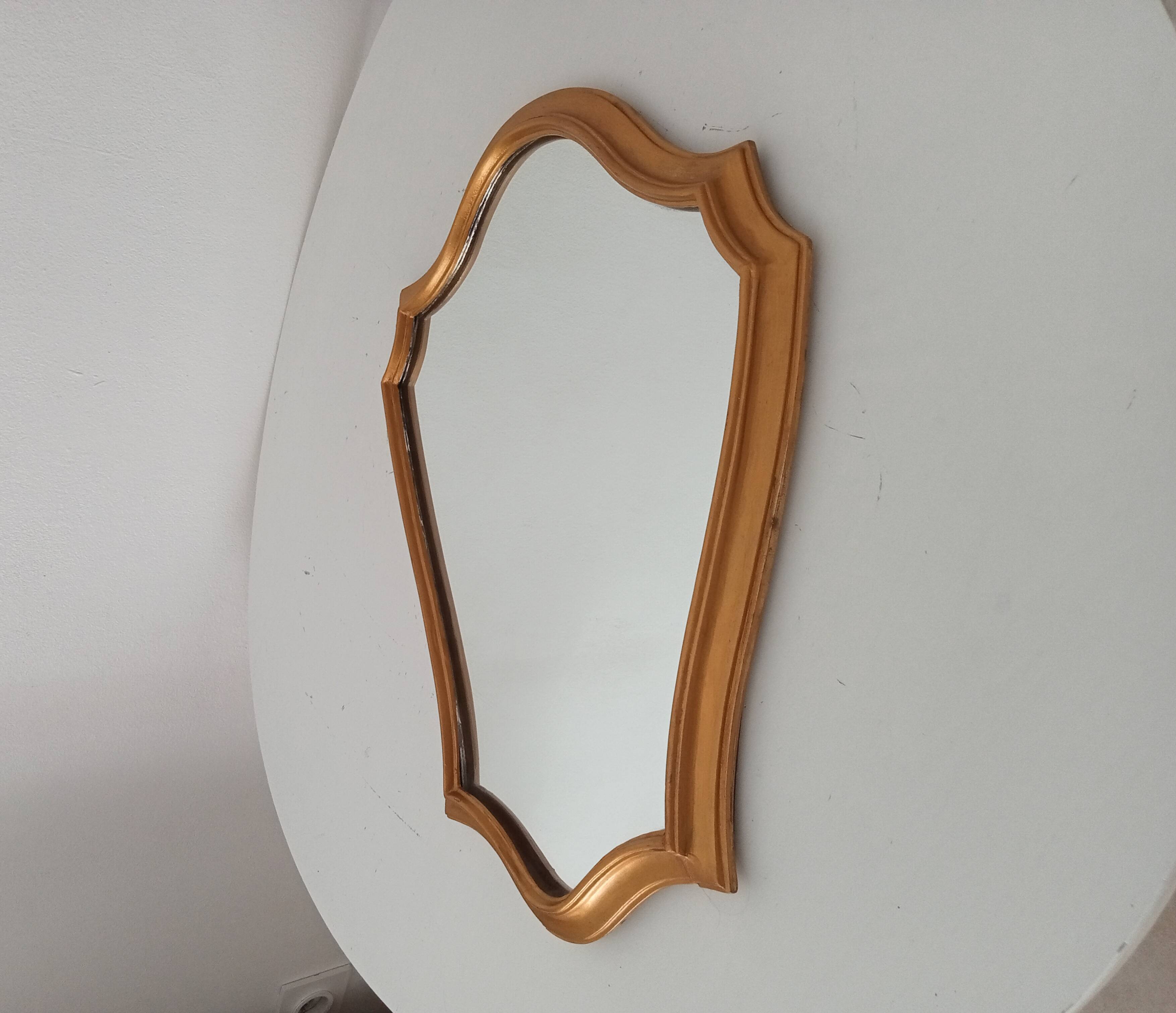 Vintage baroque mirror in gilded wood