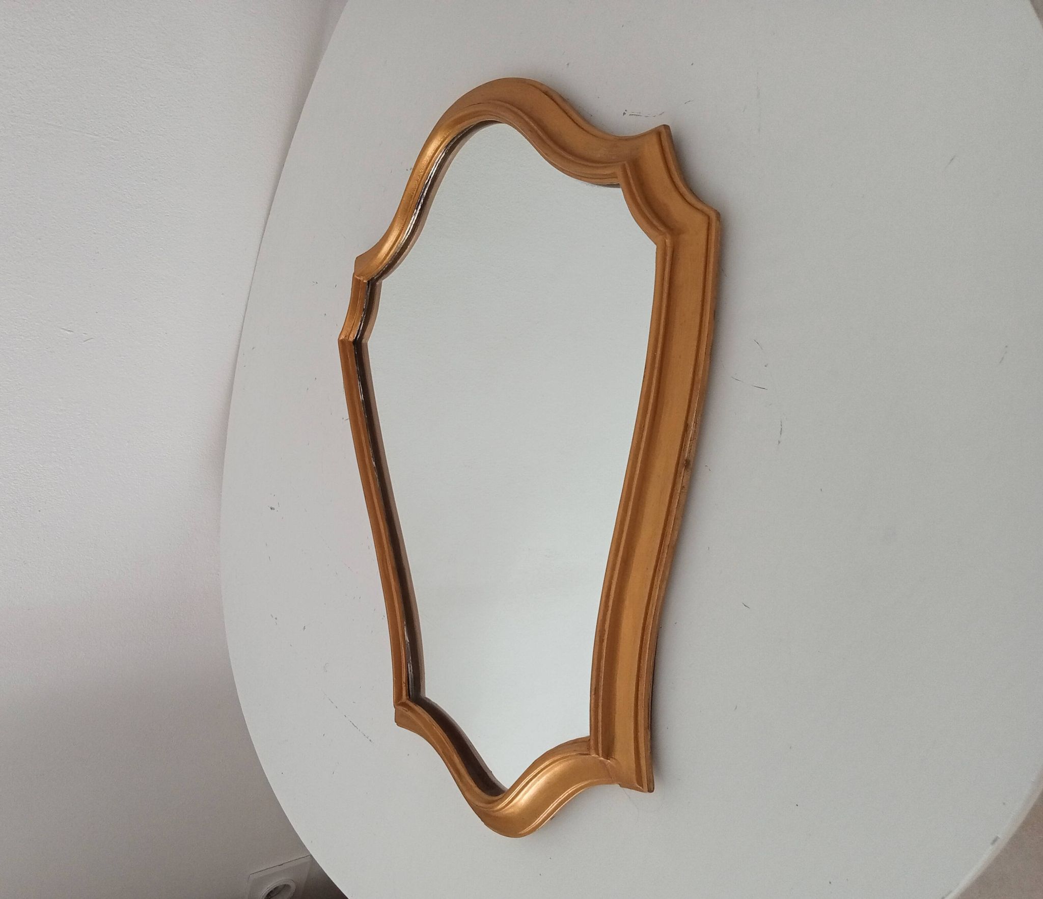 Vintage baroque mirror in gilded wood