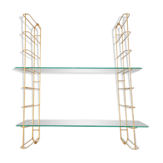 Golden wall and glass shelf