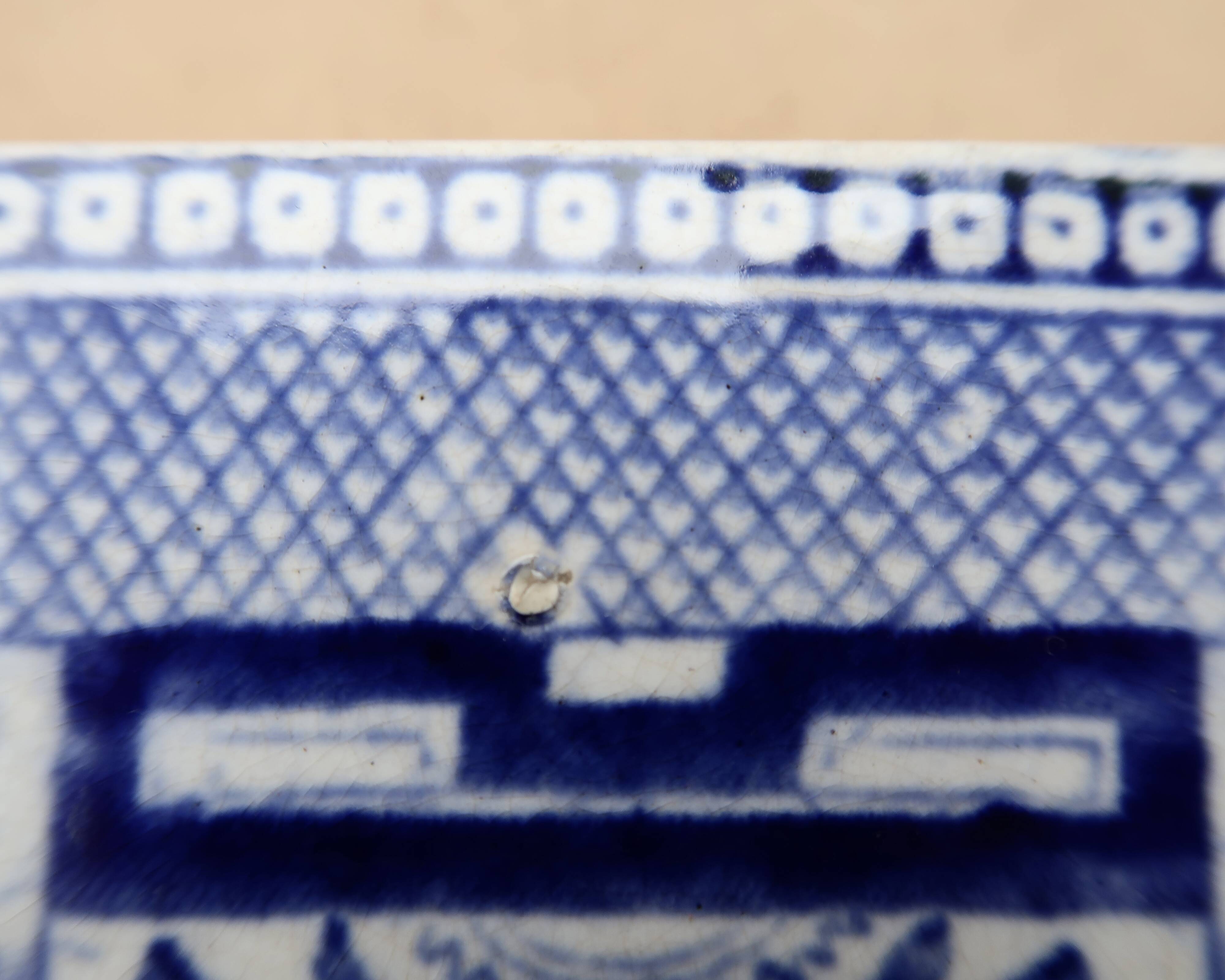 Large oval dish in blue and white English earthenware with Asian decoration, 19th century.
