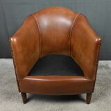 Solange club armchair in sheepskin leather.