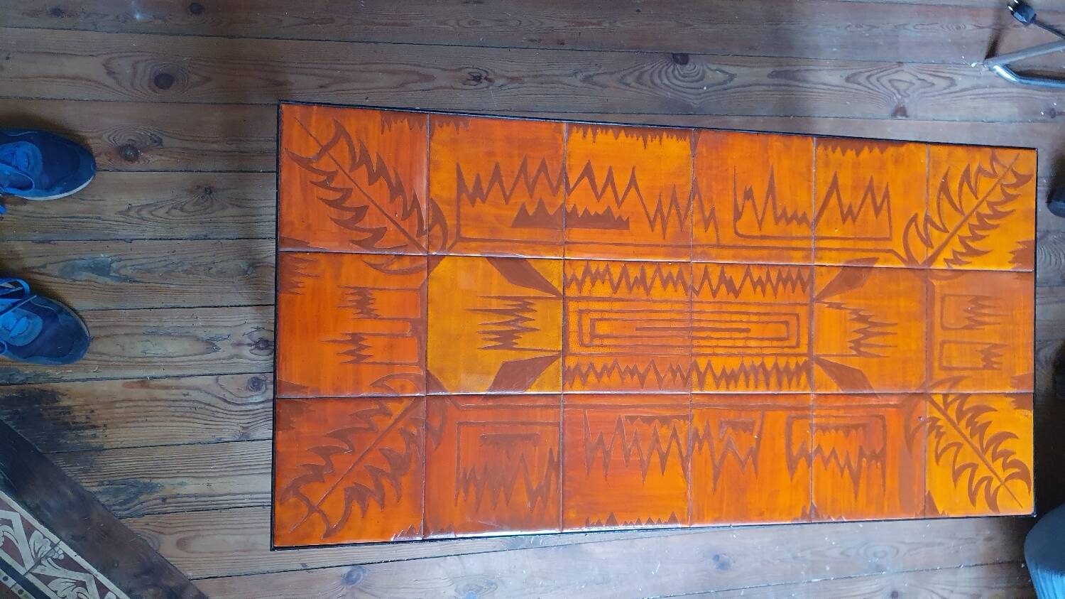 Wrought iron and orange ceramic coffee table