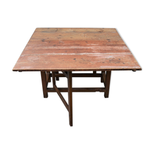 Ancienne table à manger en pin du début du XIXe siècle avec un pied de porte en forme de feuille