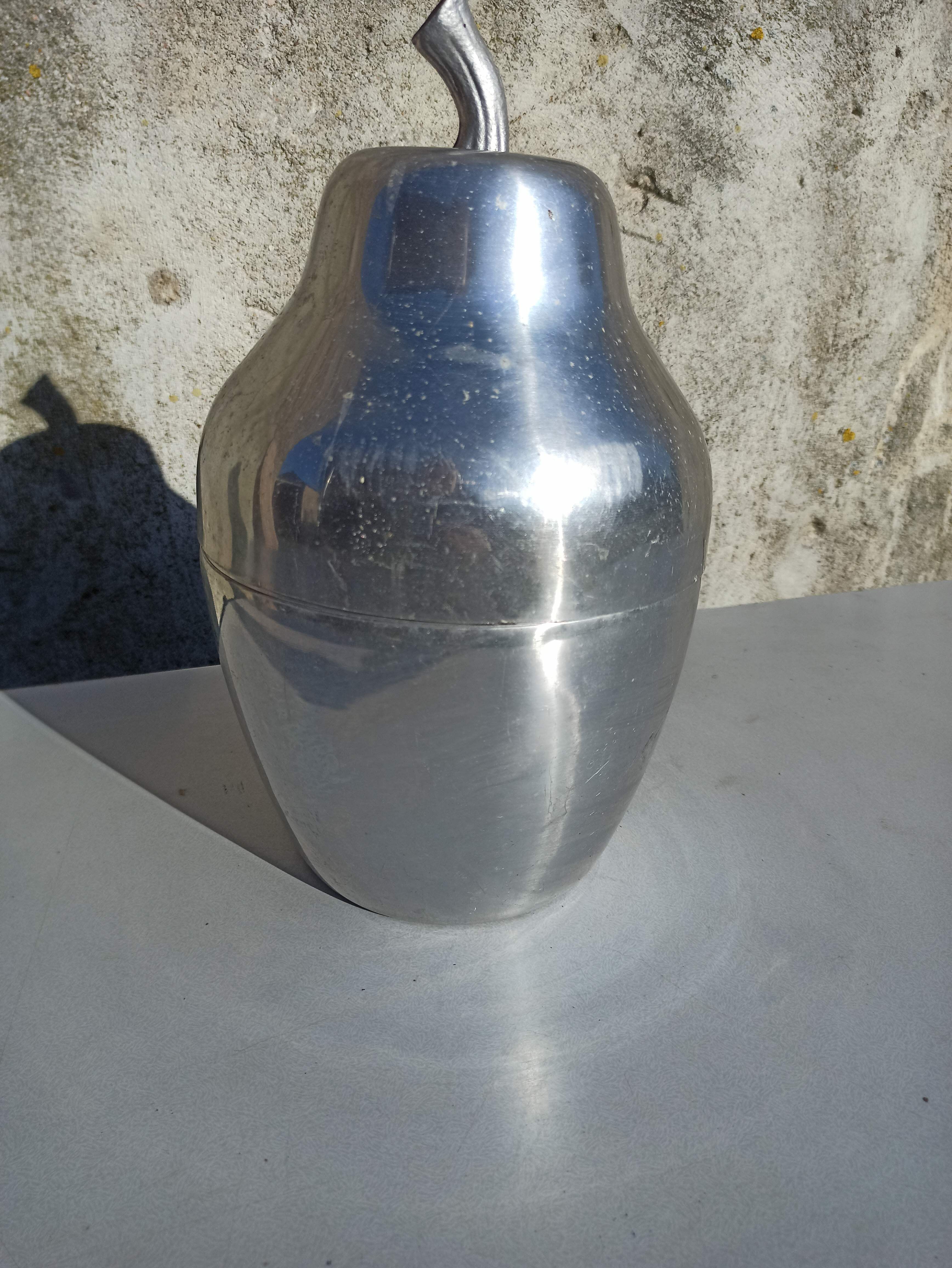 Old ice bucket ice cube in the shape of aluminum pear
