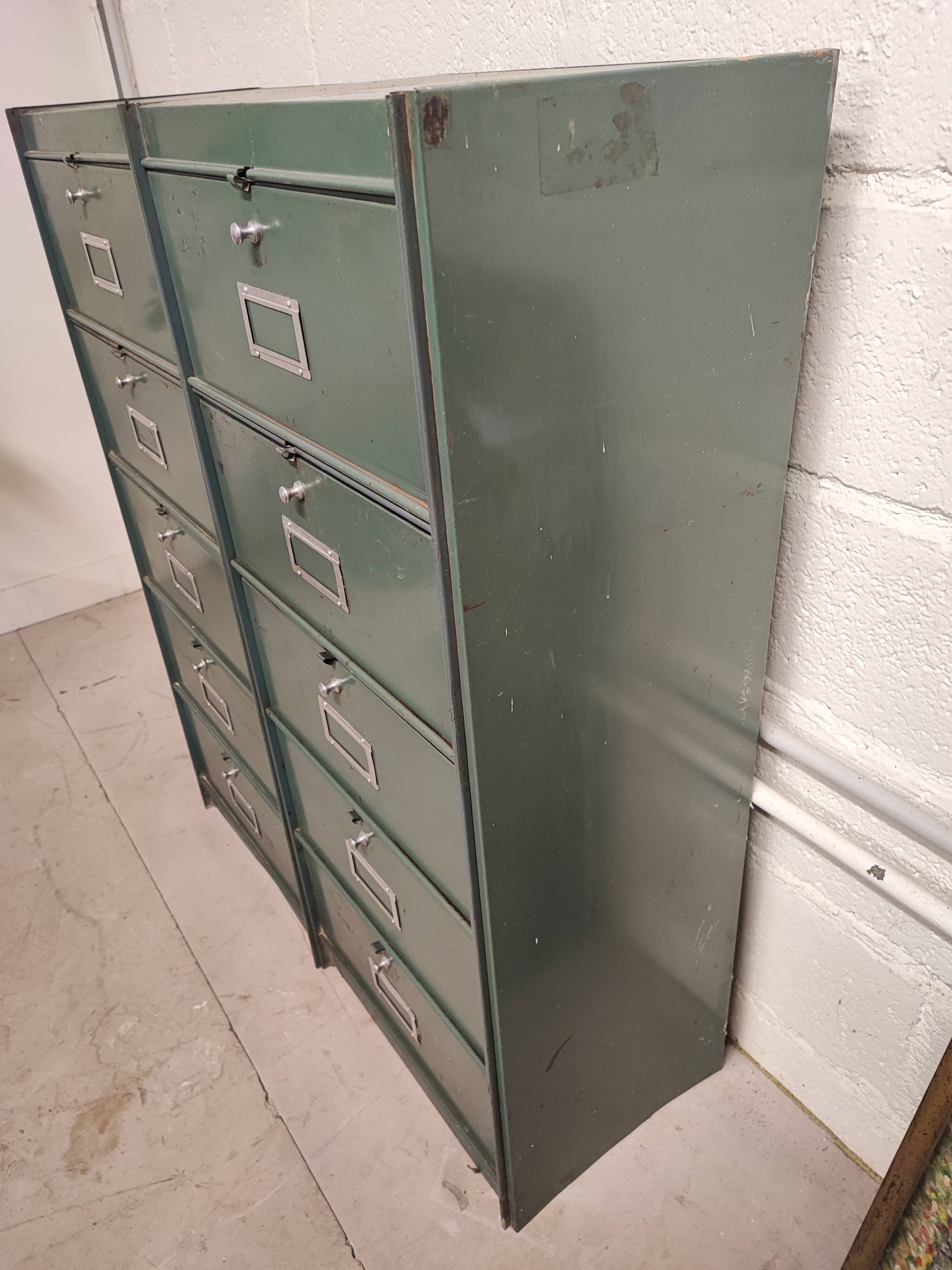 10-compartment metal locker with hinged door from the 50s