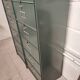 10-compartment metal locker with hinged door from the 50s