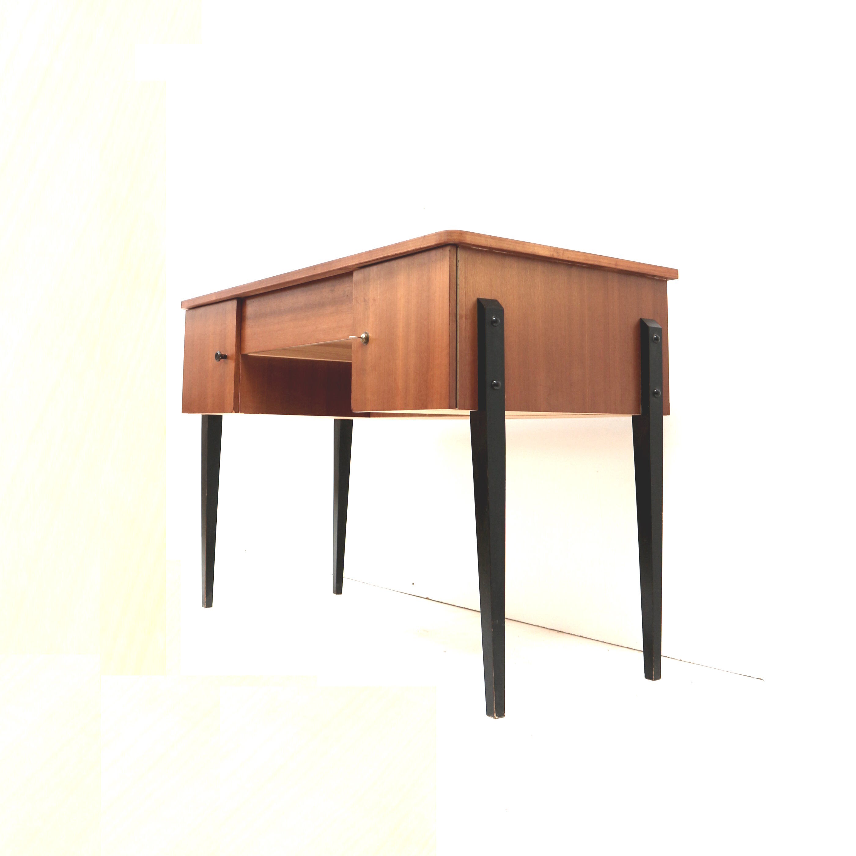 Elegant vintage desk with black legs made in the 60s