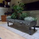 Large baroque style interior planter in gray patinated wood