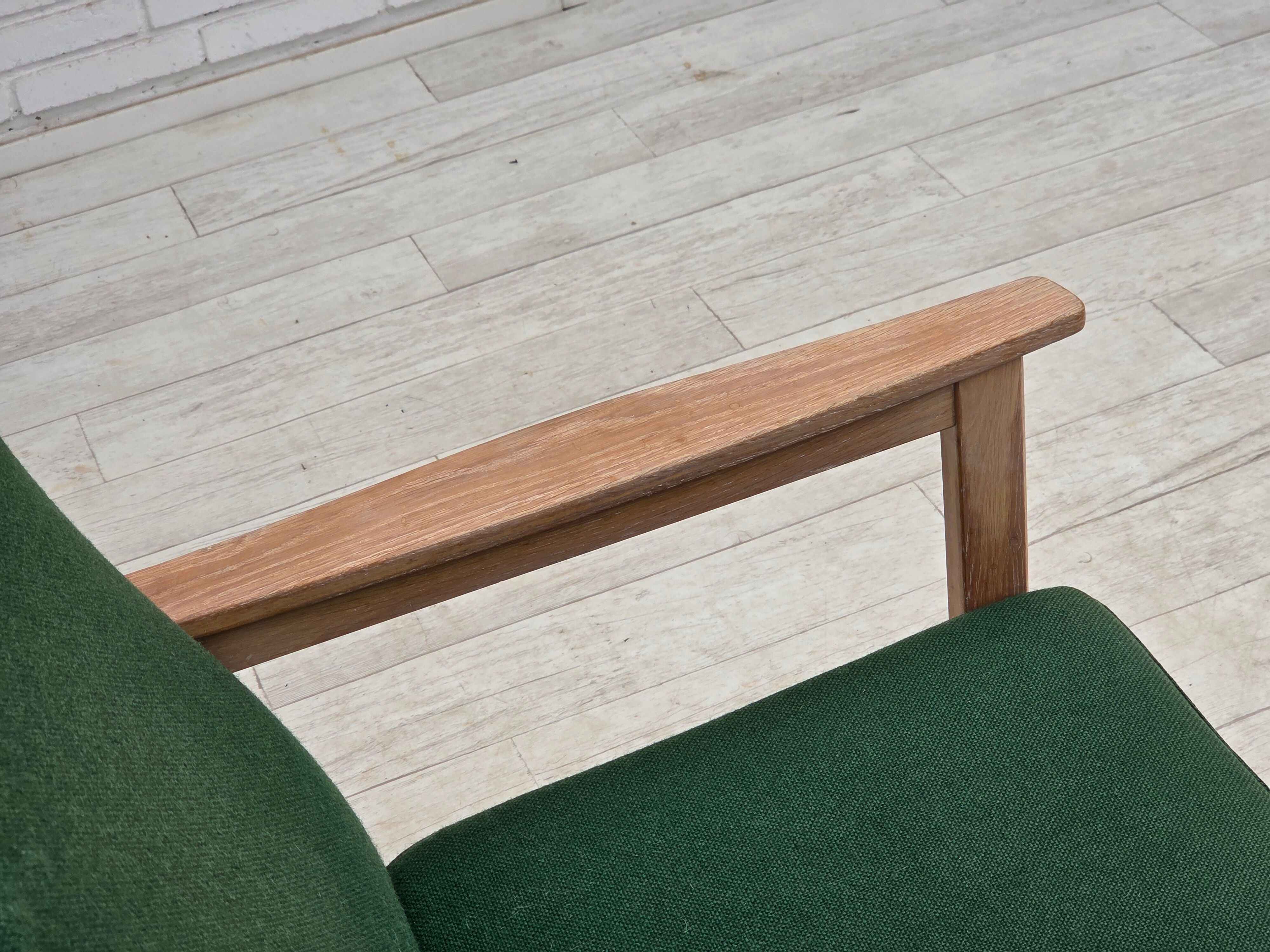 1980s, Danish armchair by Høng Stole, green furniture wool, oak wood.