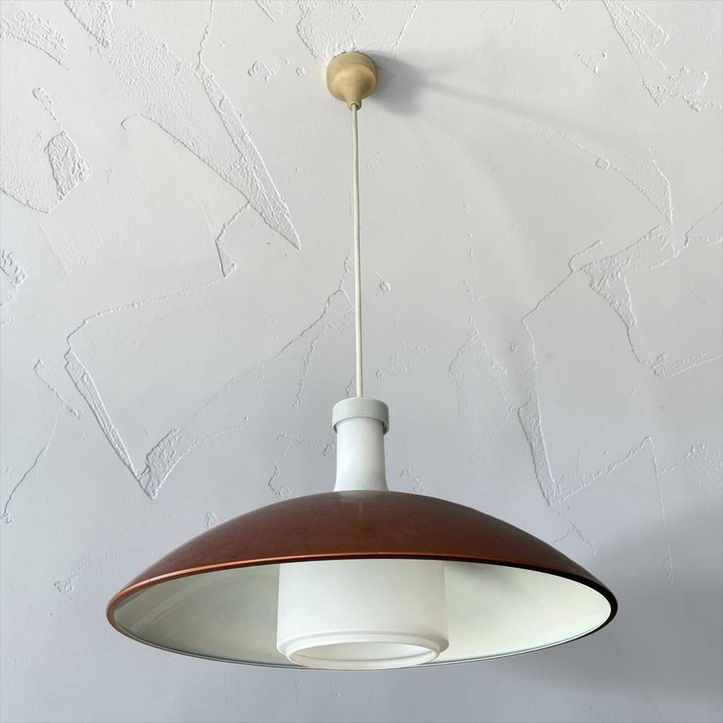 Vintage orange rust metal pendant light with opaline glass.