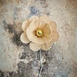 Flower wall light made of rattan petals and nude embroidery