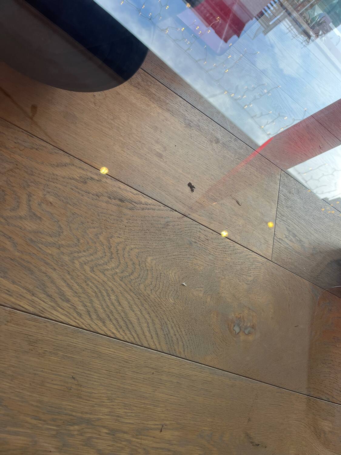 Gae Aulenti coffee table for Fontana Arte, transparent glass top with black cast iron supports, 1980s.