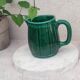 Old green jug