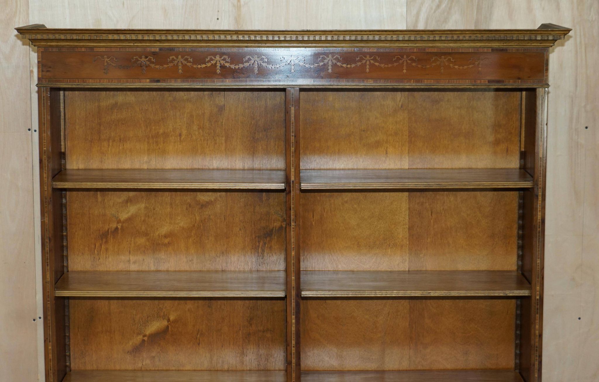 Pair of Sheraton Revival bookcases in satinwood, walnut, and yew.