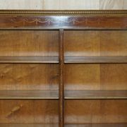 Pair of Sheraton Revival bookcases in satinwood, walnut, and yew.
