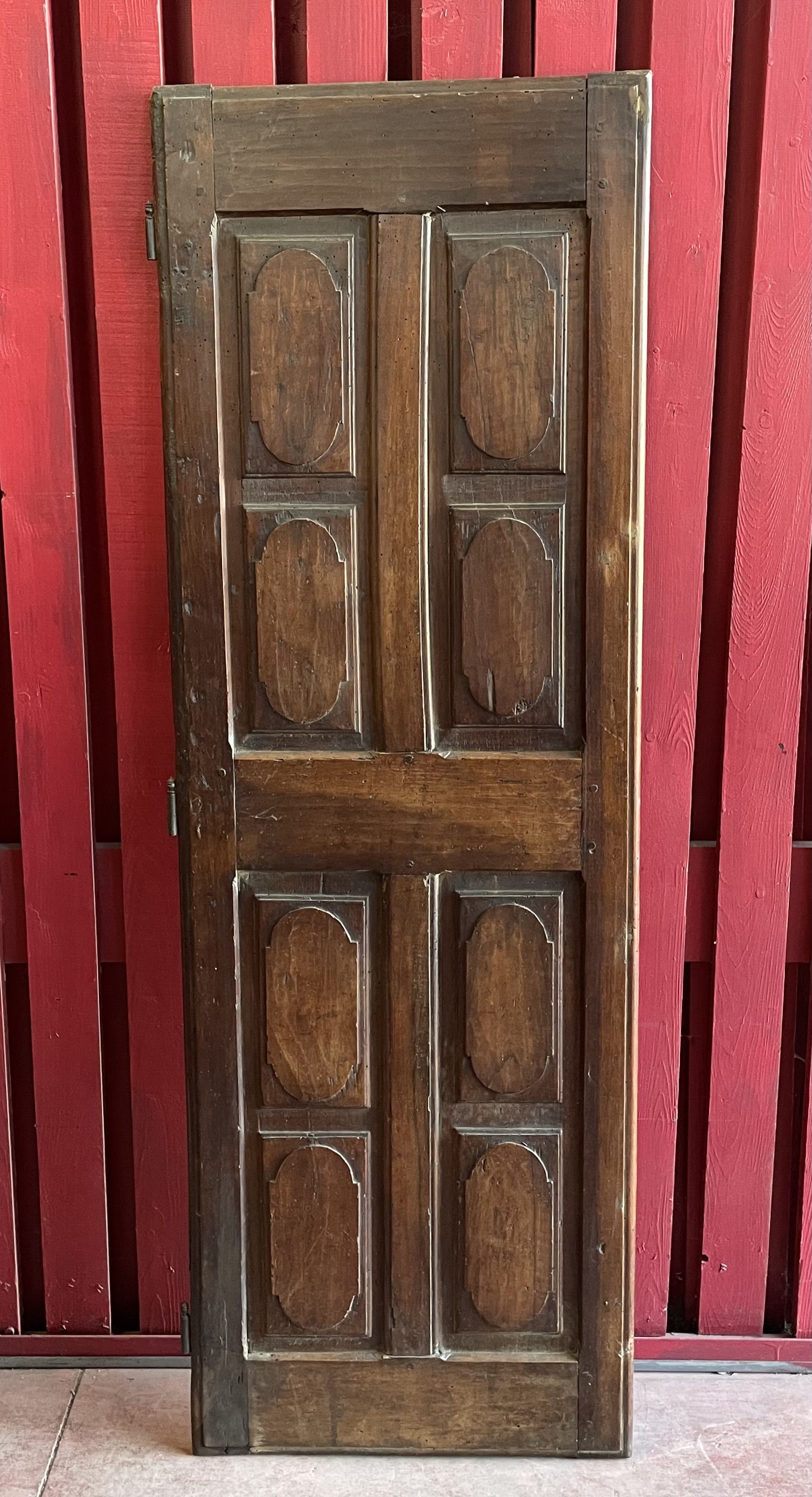 France old 18th century walnut closet door. Composed of 8 finely carved panels.