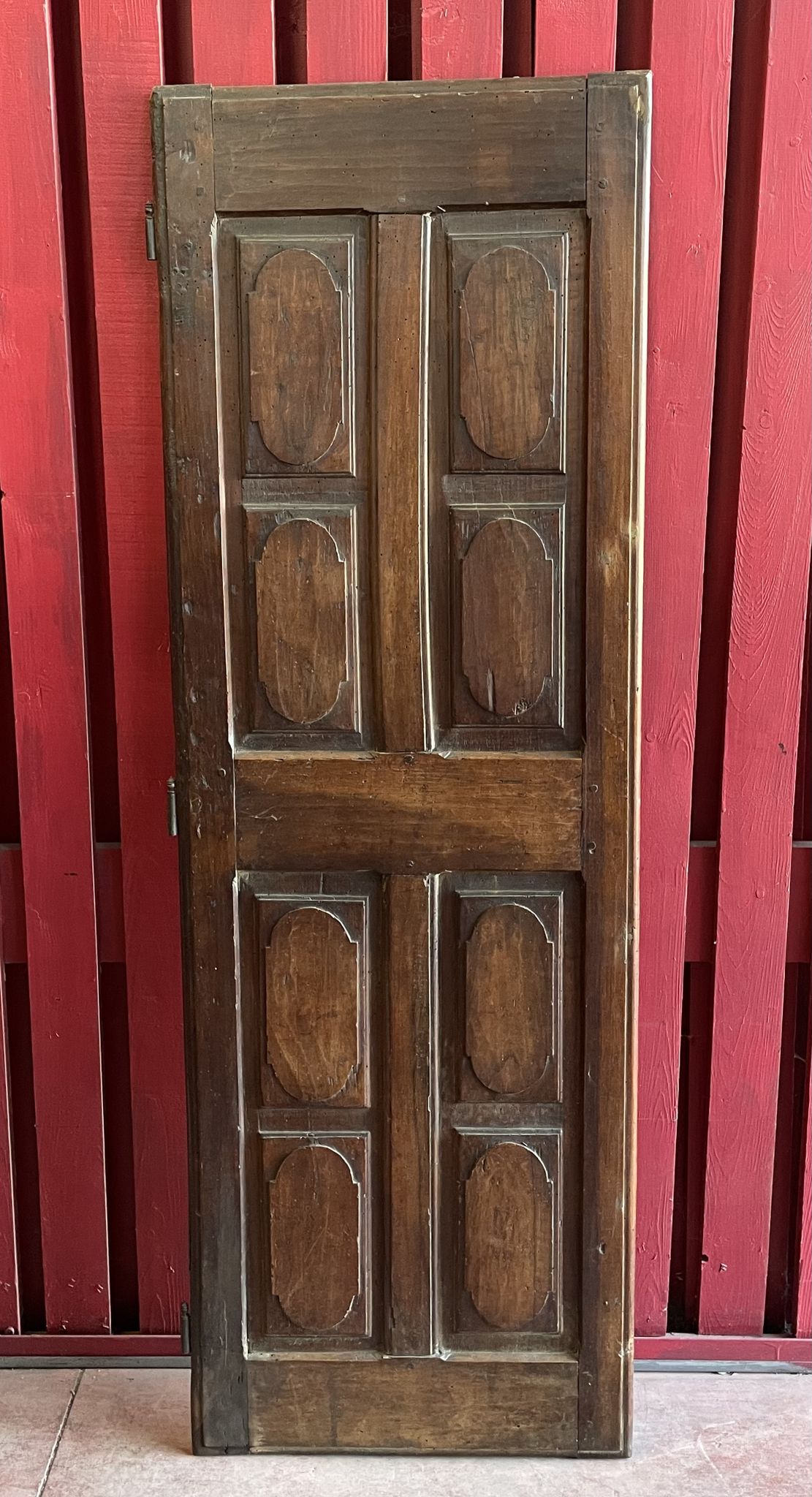 France old 18th century walnut closet door. Composed of 8 finely carved panels.