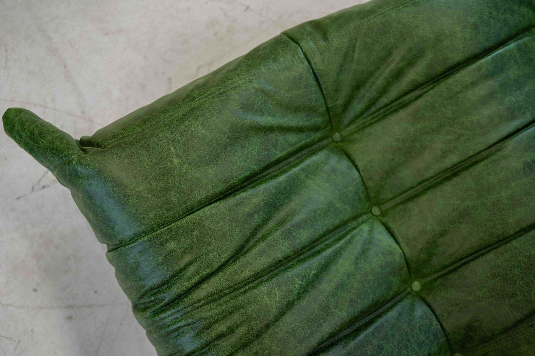 Togo chaise lounge in green leather attributed to Michel Ducaroy for Ligne Roset, 1974