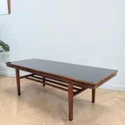 Vintage Danish coffee table in teak with a black top from the 1960s.