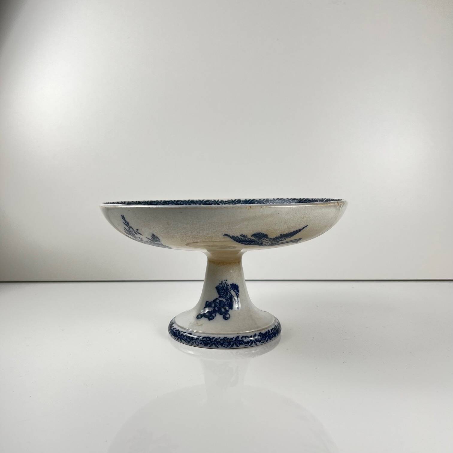Pexonne iron earth compote dish, blue bird motif, late 19th century