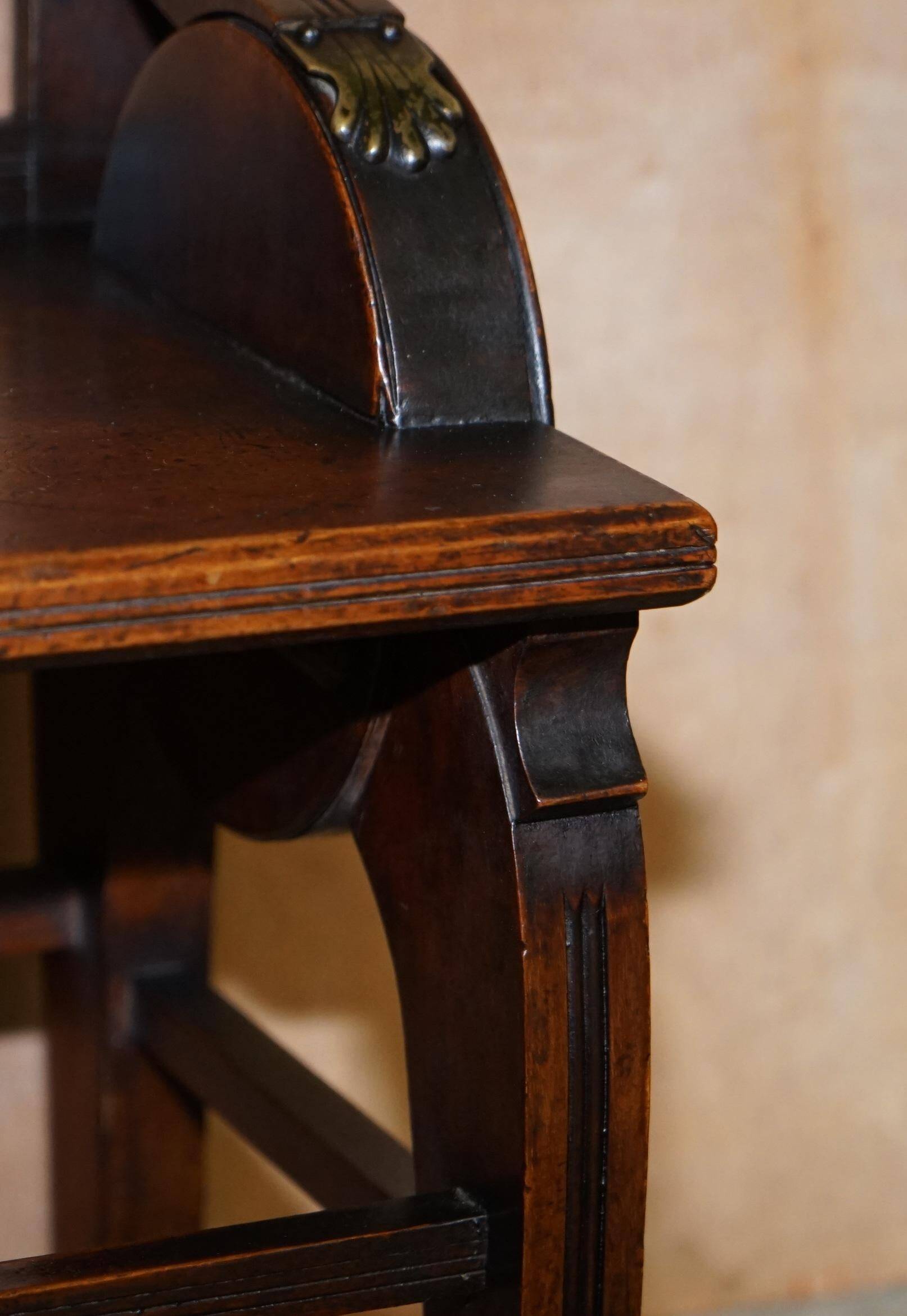 Antique entrance bench by Jas Shoolbred with brass fittings and walnut frame circa 1890.