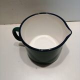 Old milk pitcher in enamelled sheet metal