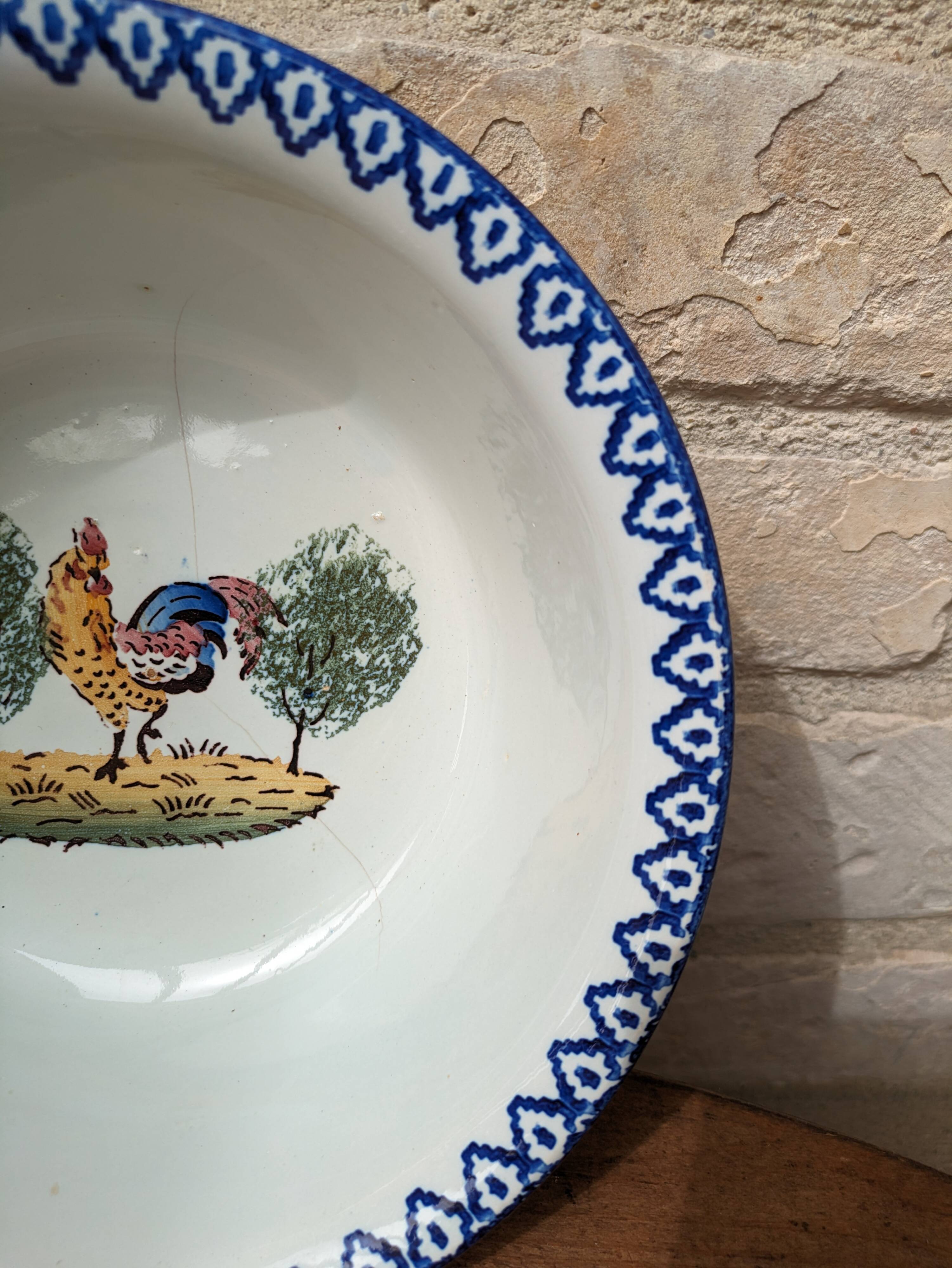 Old hollow serving dish with Saint Clément rooster motif France