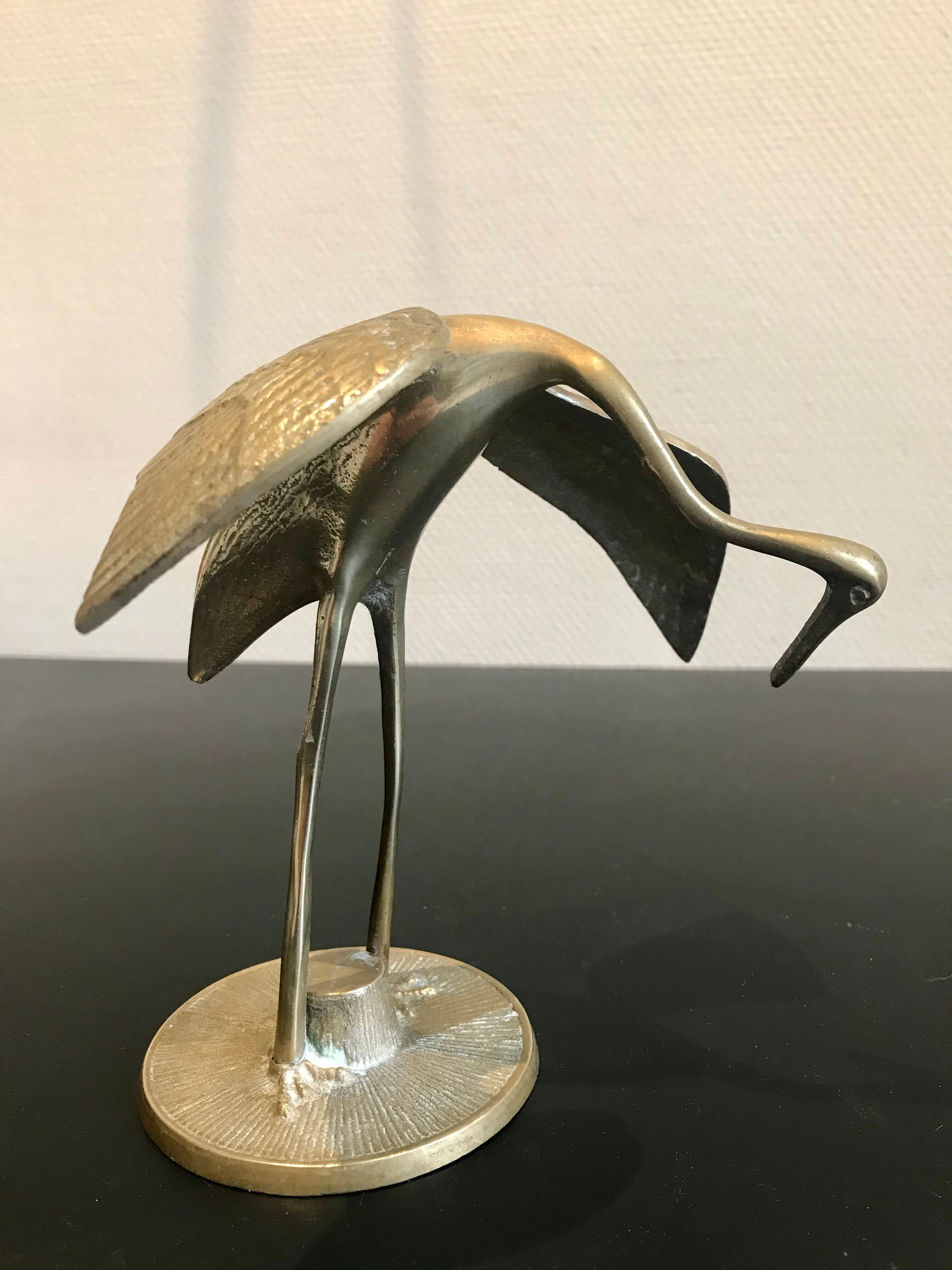Couple of brass birds