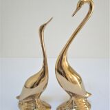 Pair of stylized birds in solid brass