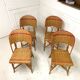 Set of 4 antique chairs in woven red and natural rattan.
