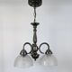 Antique Art Deco chandelier with 3 arms in patinated metal and ribbed glass.