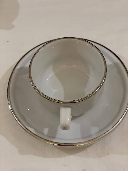 Four porcelain "bistro" cups and saucers
