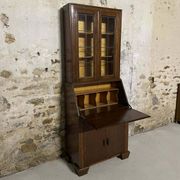 Oak display secretary cabinet with drop-down front, two sections.