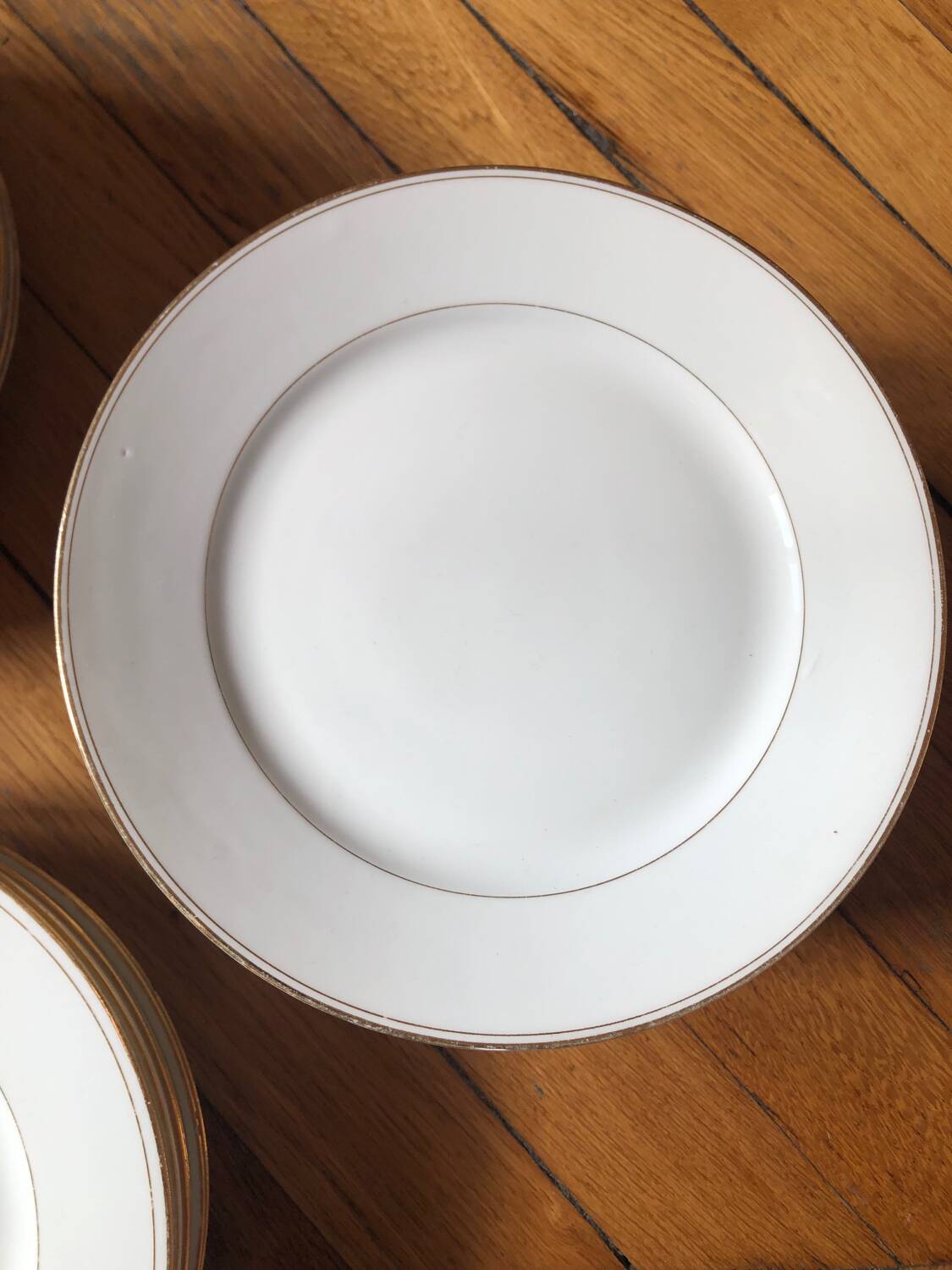 Lot of 28 porcelain plates with golden edging