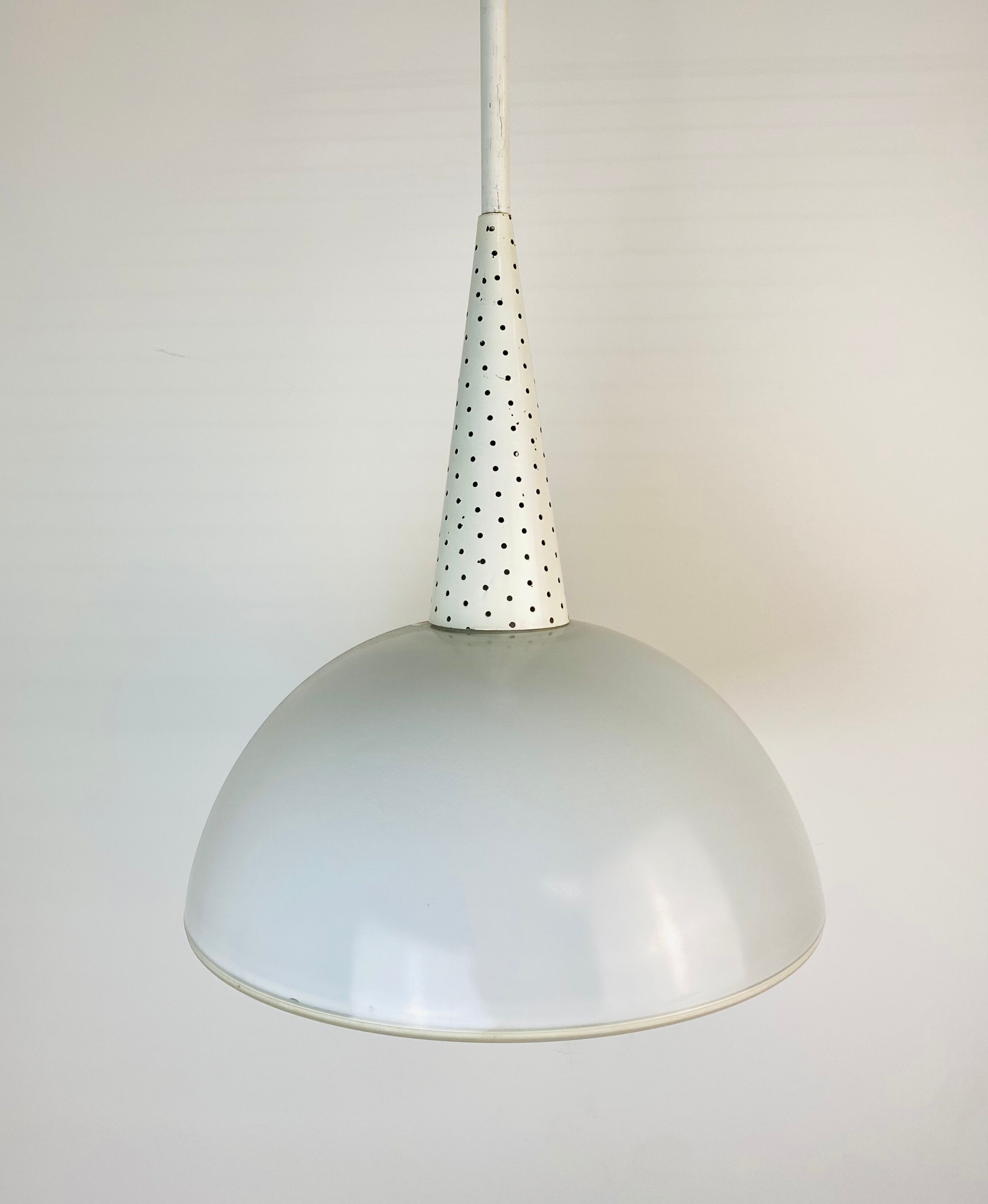 Perforated metal suspension holophanous glass