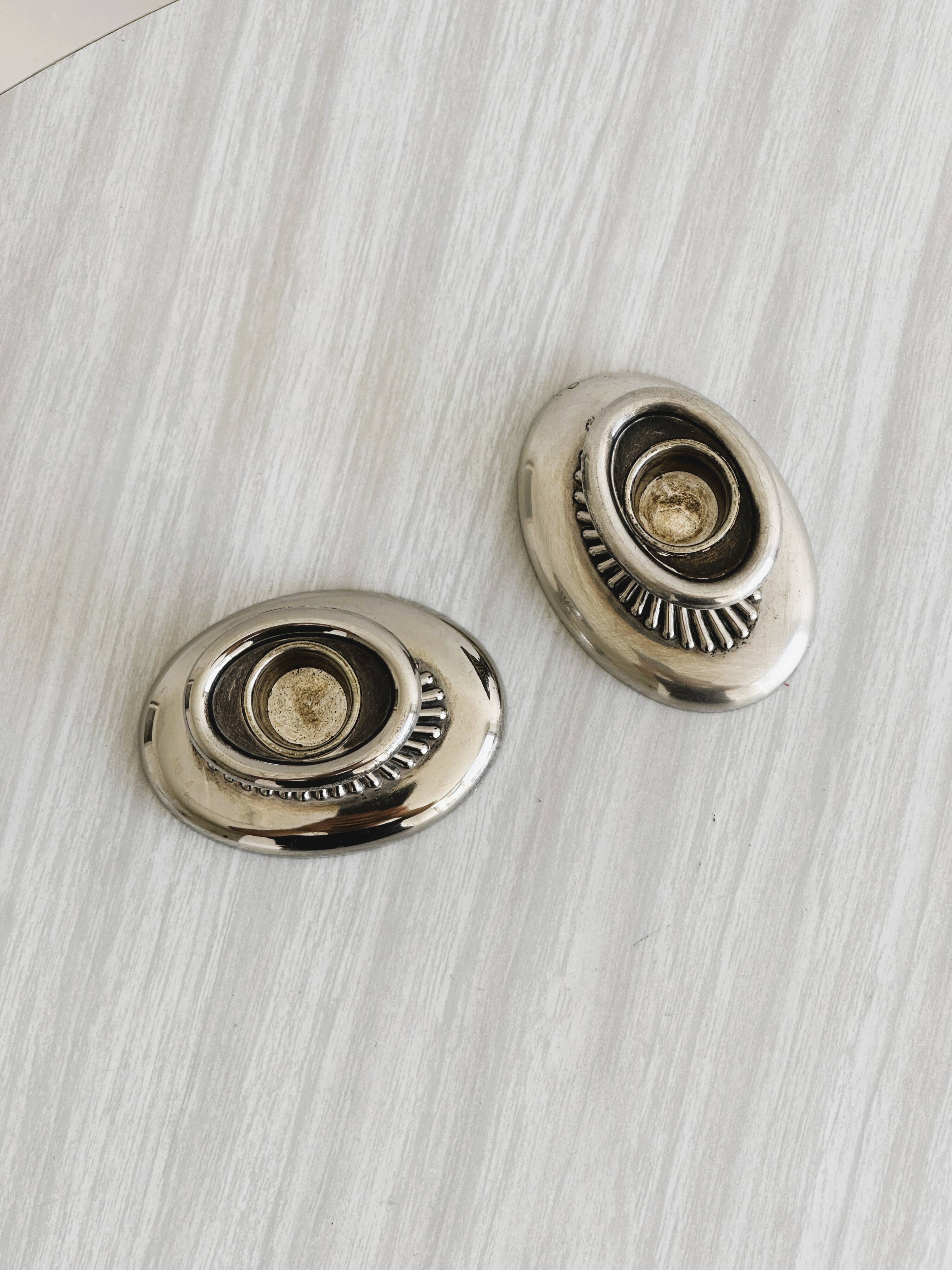 Pair of antique metal candlesticks