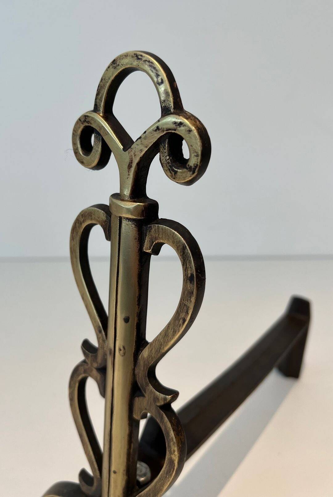 Pair of Brass and Wrought Iron Chenets with Triple Volute and Mount Torch Holders