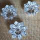 A set of 3 vintage star flower glass candle holders.